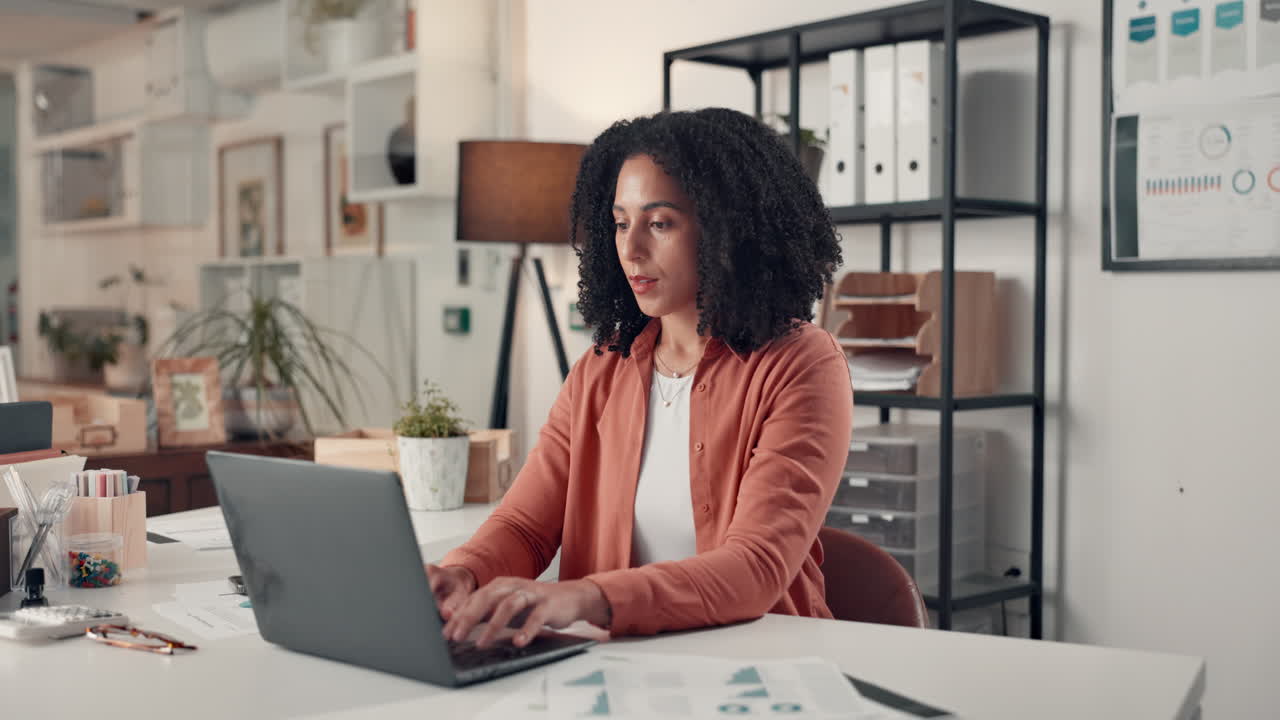 Woman working on laptop in office