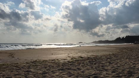 stormy sea, windy weather, waves on the beach, cloudy sky, cross