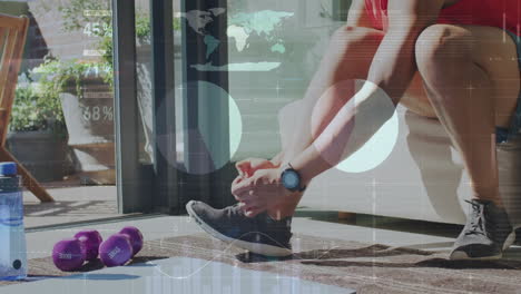 person tying shoelaces with fitness data animation over exercise equipment at home