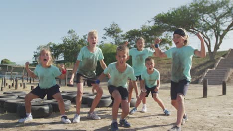 group of caucasian children training at boot camp