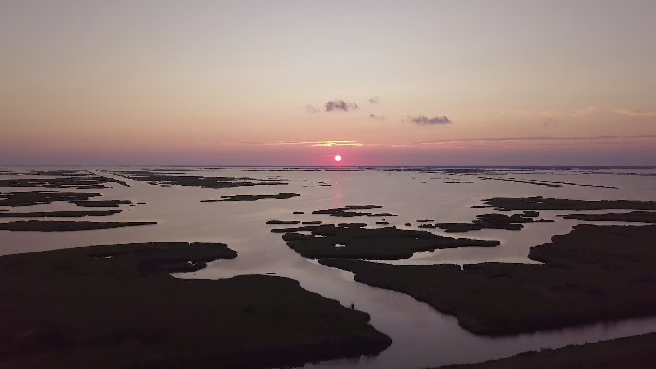 Drone shot of the sun setting over he bayou in Isle de Jean Charles, Louisiana. Rise Up