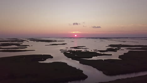 drone shot of the sun setting over he bayou in isle de jean charles, louisiana. rise up