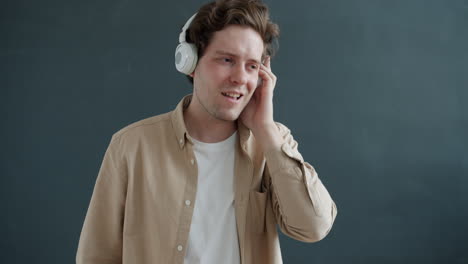man dancing to music with headphones