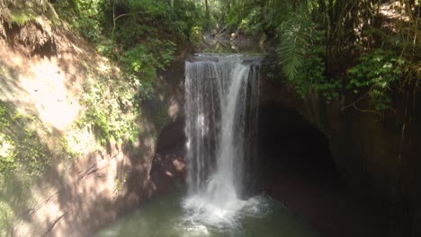 Suwat-Waterfall-in-Bali-hidden-in-a-Tropical-jungle-amid-bamboo-forest-and-lush-green-vegetation