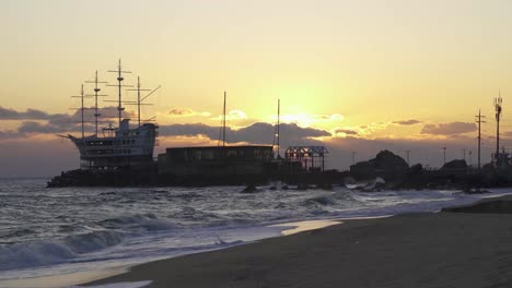 sea shore of south korea during sunrise (towards east sea).  person, ship, sea waves, clouds and sunrise. shot with sony a7iii 4k with 29.97fps .