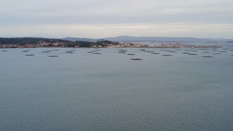 establishing drone shot of boiro, coastal fishing town