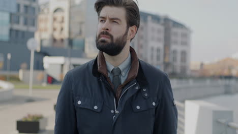businessman checking the time in the city