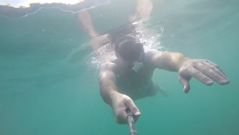 man snorkeling in the ocean