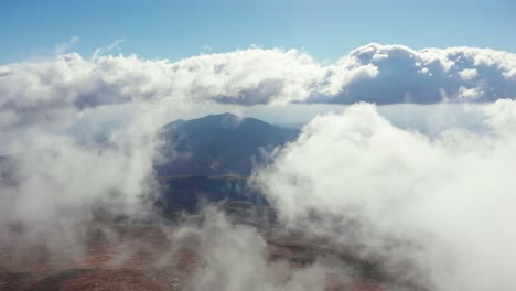 Drone-video-flying-above-clouds-top-peak-Mountain-Kaimaktsalan-sunny