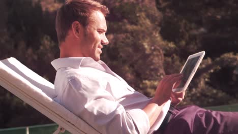 Man-using-tablet-in-the-garden