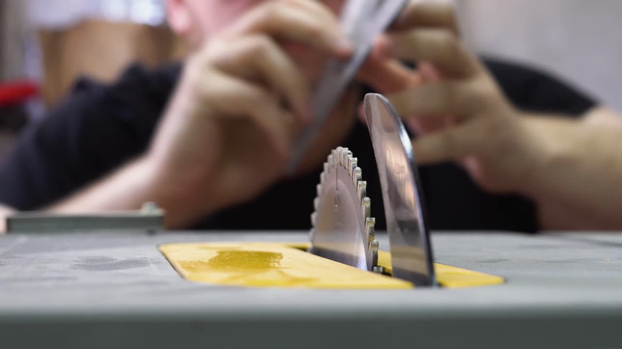 Close-up of table saw angle check in a workshop with focus and precision