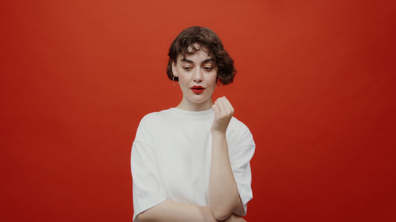 Woman in White T-shirt against Red Background
