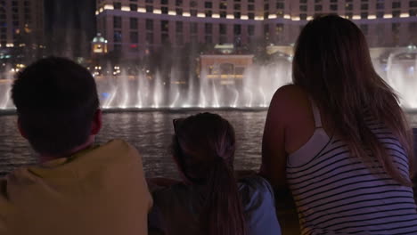 people watching a nightly fountain show