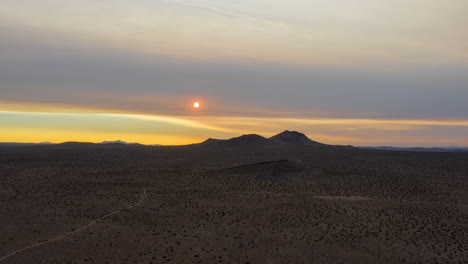 Sun-rises-through-the-smoky-haze-left-by-wildfires-in-California---aerial-hyperlapse