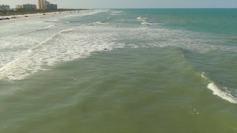 A-slow-aerial-tilt-up-view-of-New-Smyrna-Beach,-Florida