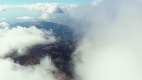 drone video flying clouds top peak mountainkaimaktsalan