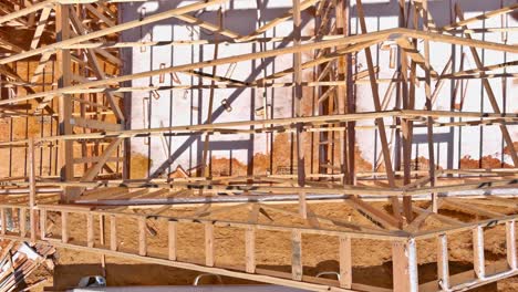 fragment of a new home under construction wood framing beams