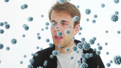 animazione delle cellule del coronavirus covid19 che si diffondono sull'uomo caucasico che si soffia il naso