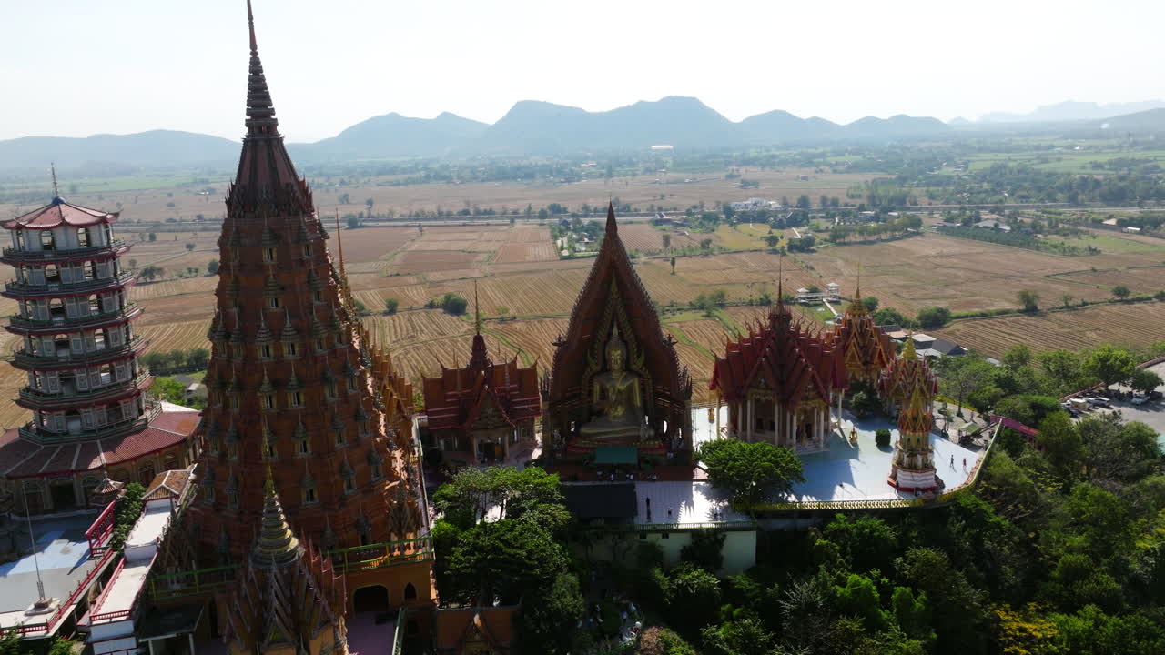 Iconic Towers Of Wat Tham Suea, Buddhist Temple In Kanchanaburi, Thailand. - aerial shot