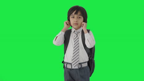 Guilty-Indian-school-boy-saying-sorry-and-apologizing-Green-screen