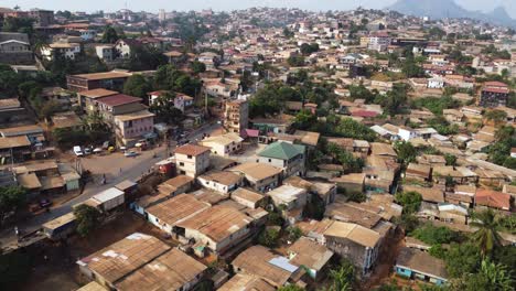 Residential-Houses-and-Real-Estate-in-Crowded-Yaounde-City,-Cameroon---Aerial-Drone-Flight