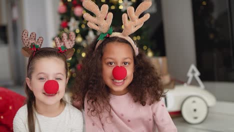 handheld video shows of two little girls in christmas costumes