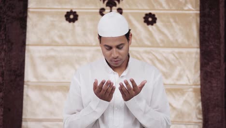 indian muslim man reading namaz to allah at home