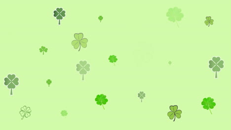 animation of multiple moving clover over green background