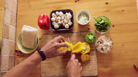 Man,-hands-and-cut-vegetables-in-kitchen