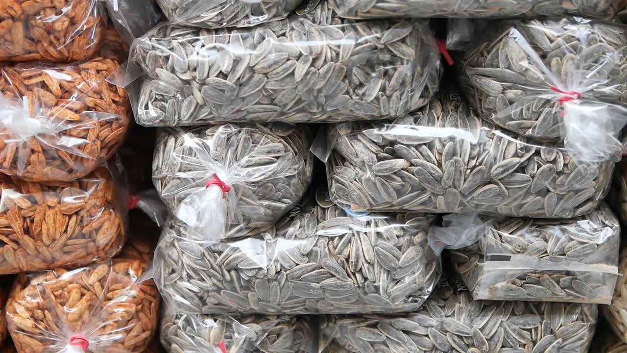 Close-up of Packaged Sunflower Seeds Stacked for Sale