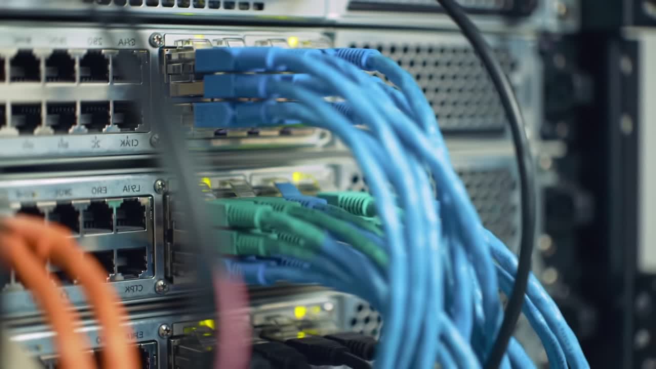 Close-Up View of Network Cables and Server Equipment Displaying Intricate Connections and Data Transmission in a High-Tech Environment