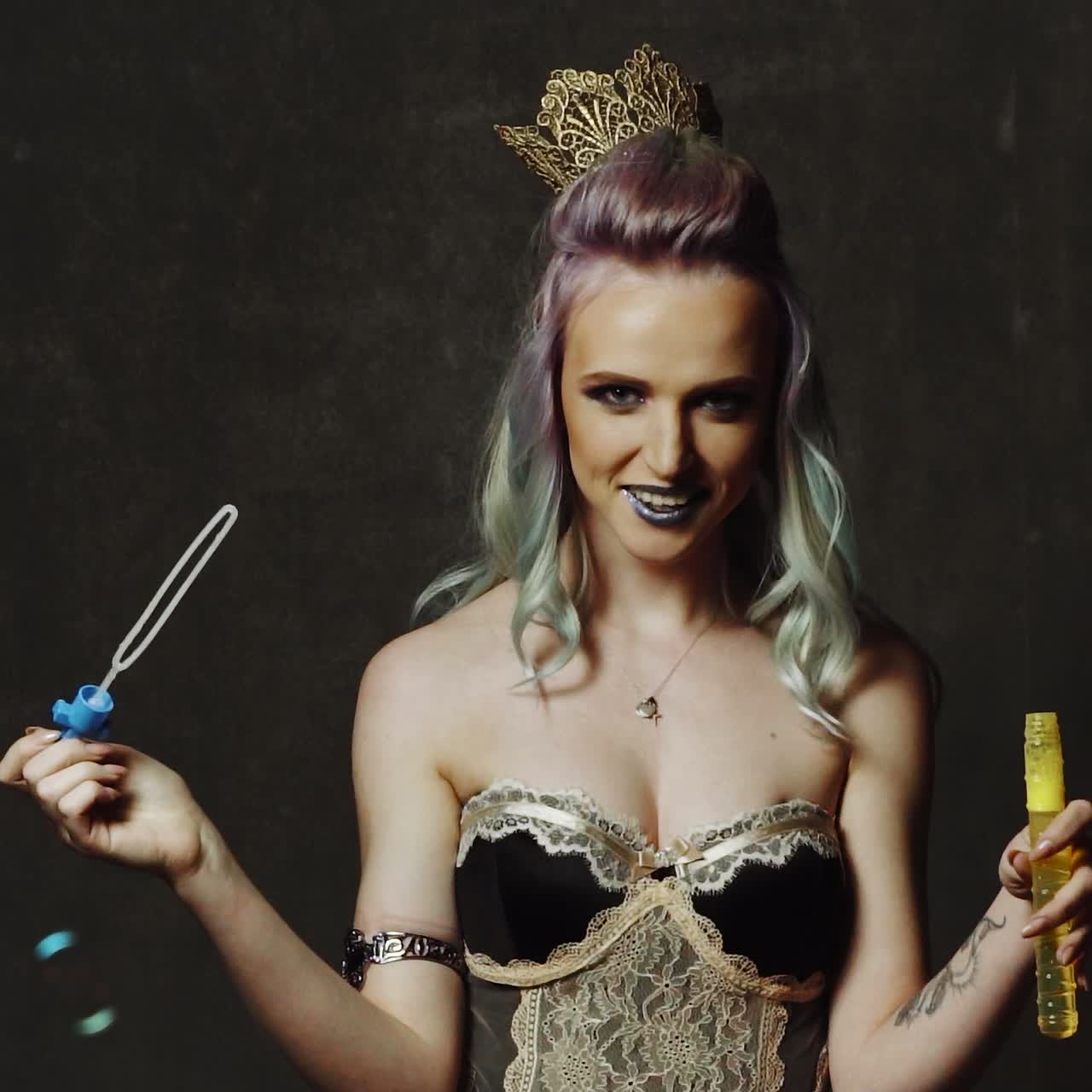 Woman with soap bubbles in studio