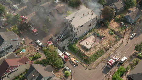 Dolly-back-revealing-shot-of-a-burning-suburban-house