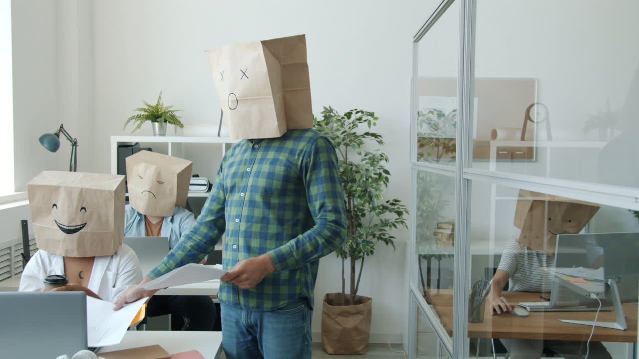 Funny Office Workers with Paper Bags on Their Heads