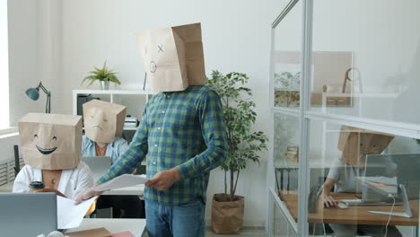 funny office workers with paper bags on their heads