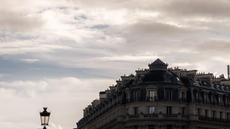 parisian building under cloudy sky