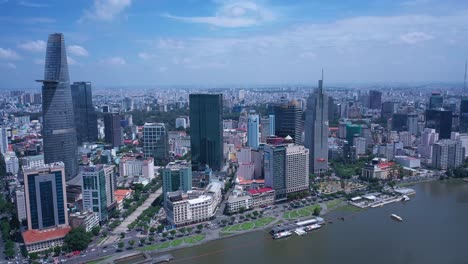 aerial view of ho chi minh city skyline featuring key buildings, with saigon river waterfront on a sunny, clear day