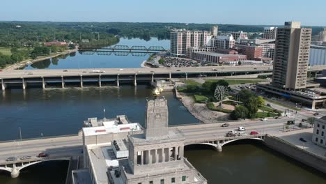 dji spark flying in a downtown midwest city. city is located on the river with pretty buildings and great shots of city architecture.