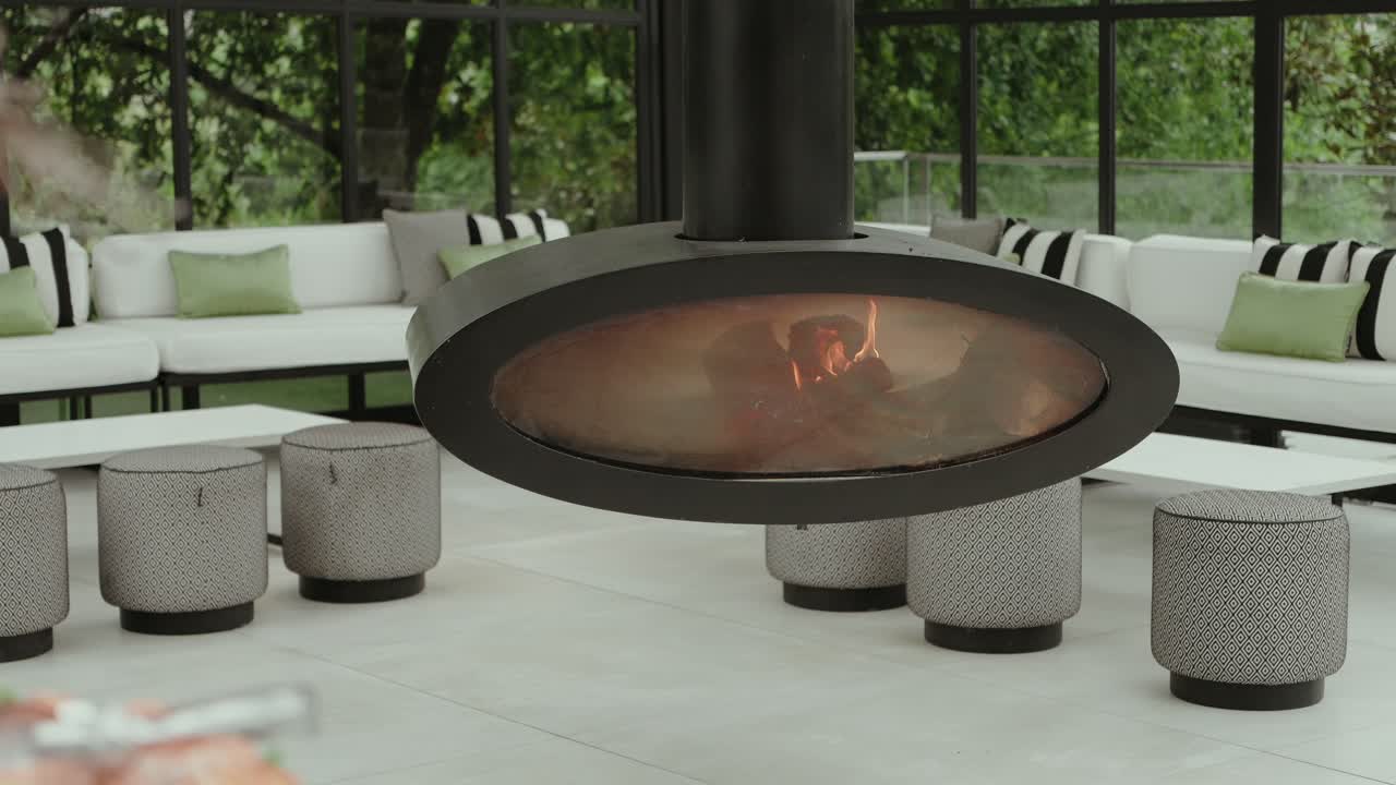 contemporary hanging fire feature in stylish indoor seating area