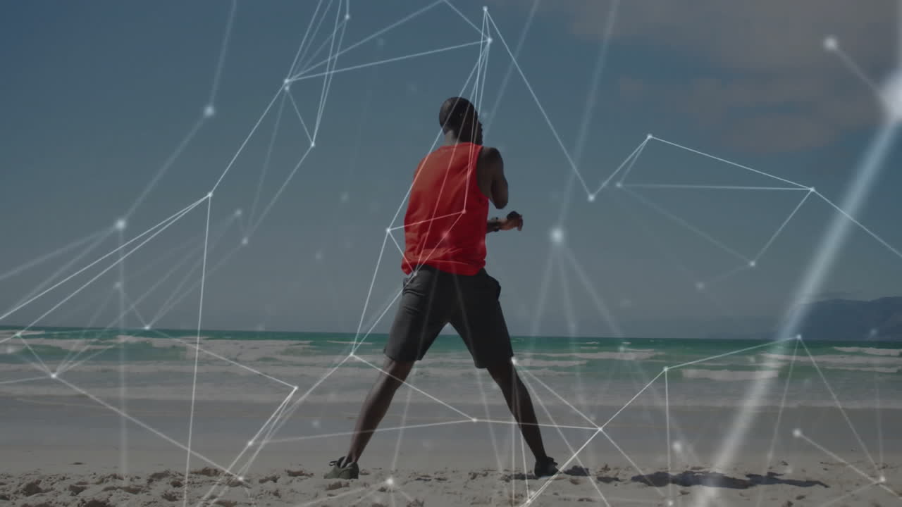 Exercising on beach, person with digital network animation overlay in background