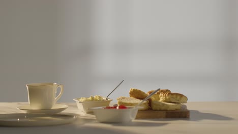 Studio Shot Of Traditional British Afternoon Tea With Scones Cream And Jam