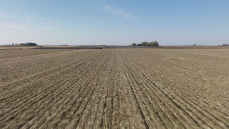 freshly strip till plowed farm field with soil rows ready for seeding, aerial