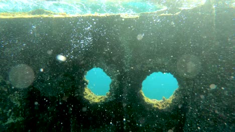 Shipwreck-at-seabed-illuminated-by-sun-rays