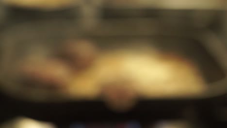 burger patties fried in pan. closeup, rack focus