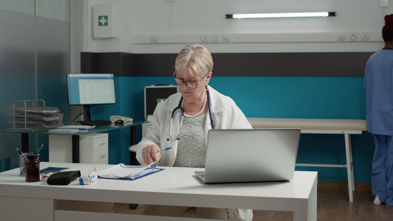 Medical physician planning checkup visit examination on laptop