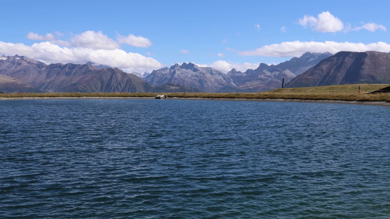 Mountain lake with Swiss alpine landscape in the background, Bettmersee near Aletsch