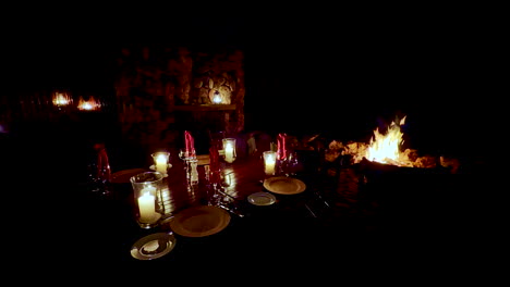 romantic outdoor dining under stars at night on safari vacation with wood fire