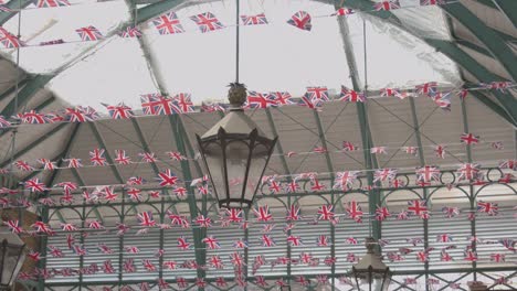 Close-Up-Of-Union-Jack-Flags-Decorating-Covent-Garden-Market-In-London-UK