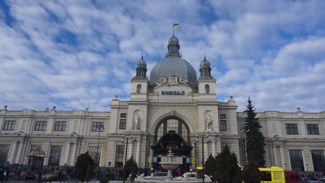 Panoramic-View-Of-Lviv-Railway-Station-In-Lviv,-Ukraine-On-A-Busy-Day---low-angle,-panning-shot