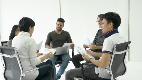 business people sit around and meeting team together. businessman and businesswoman sharing ideas together, middle east or transcontinental region centered on western asia.